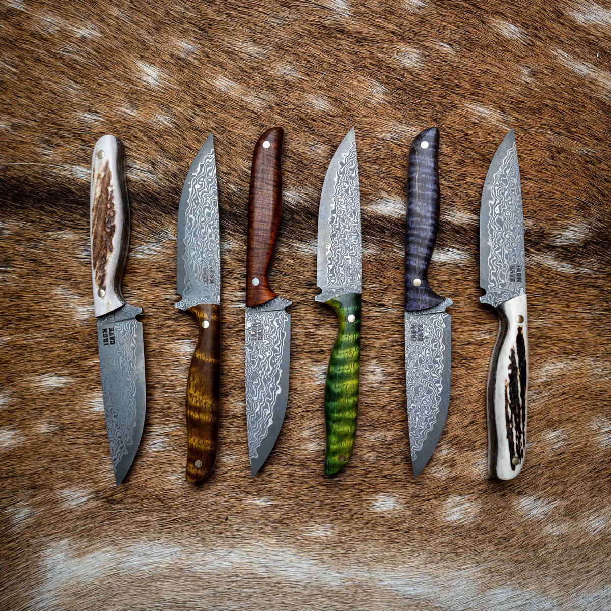 Handmade Iron Gate knives on a black background