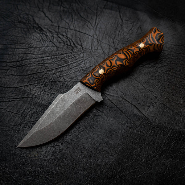 Wide Hunter — Orange & Black Layered G10, Rock Face