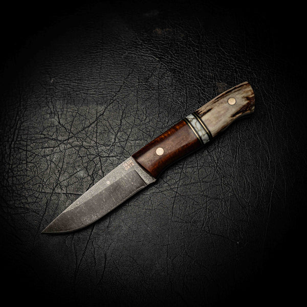 N690 Bushcraft – Fallow Deer Antler, White TruStone & Ringed Gidgee