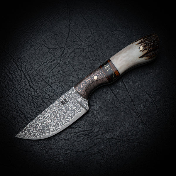Drop Point Hunter – Damascus Steel with Copper Carbon Fiber, Ironwood, Trustone & Antler