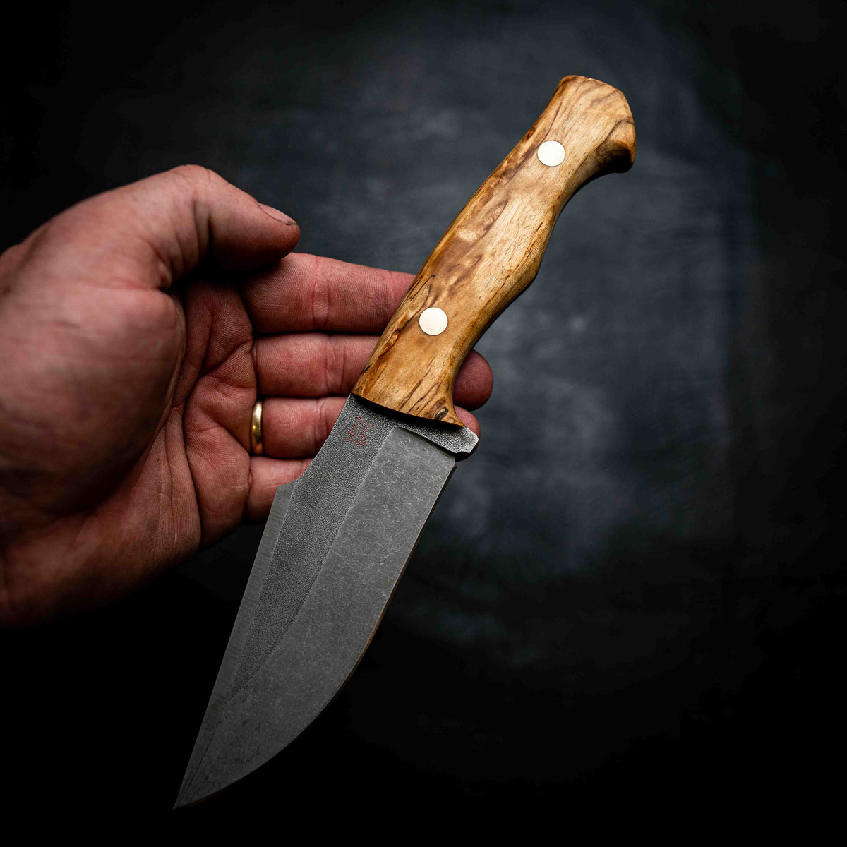 Handmade Iron Gate knives on a black background