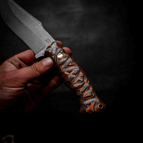 Large Hunter — Black & Orange Layered G10, Rock Face