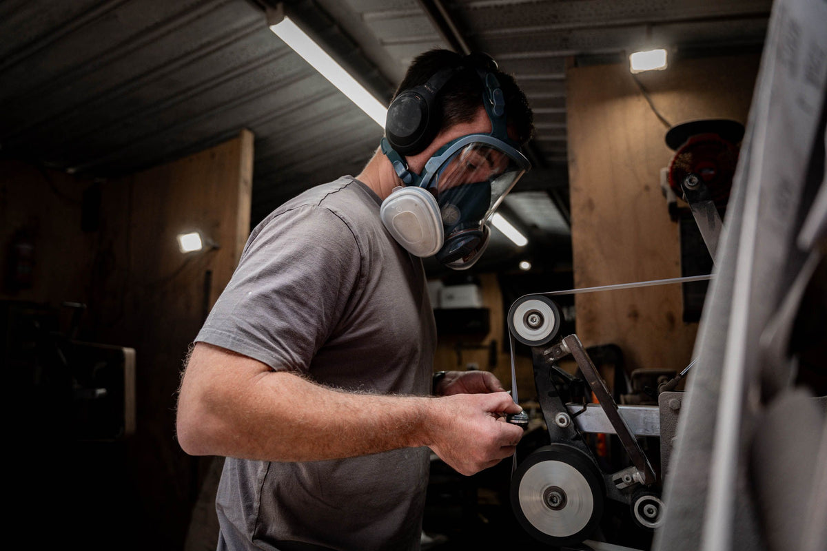 Making a knife at the Iron Gate Knives workshop in Anna Bay