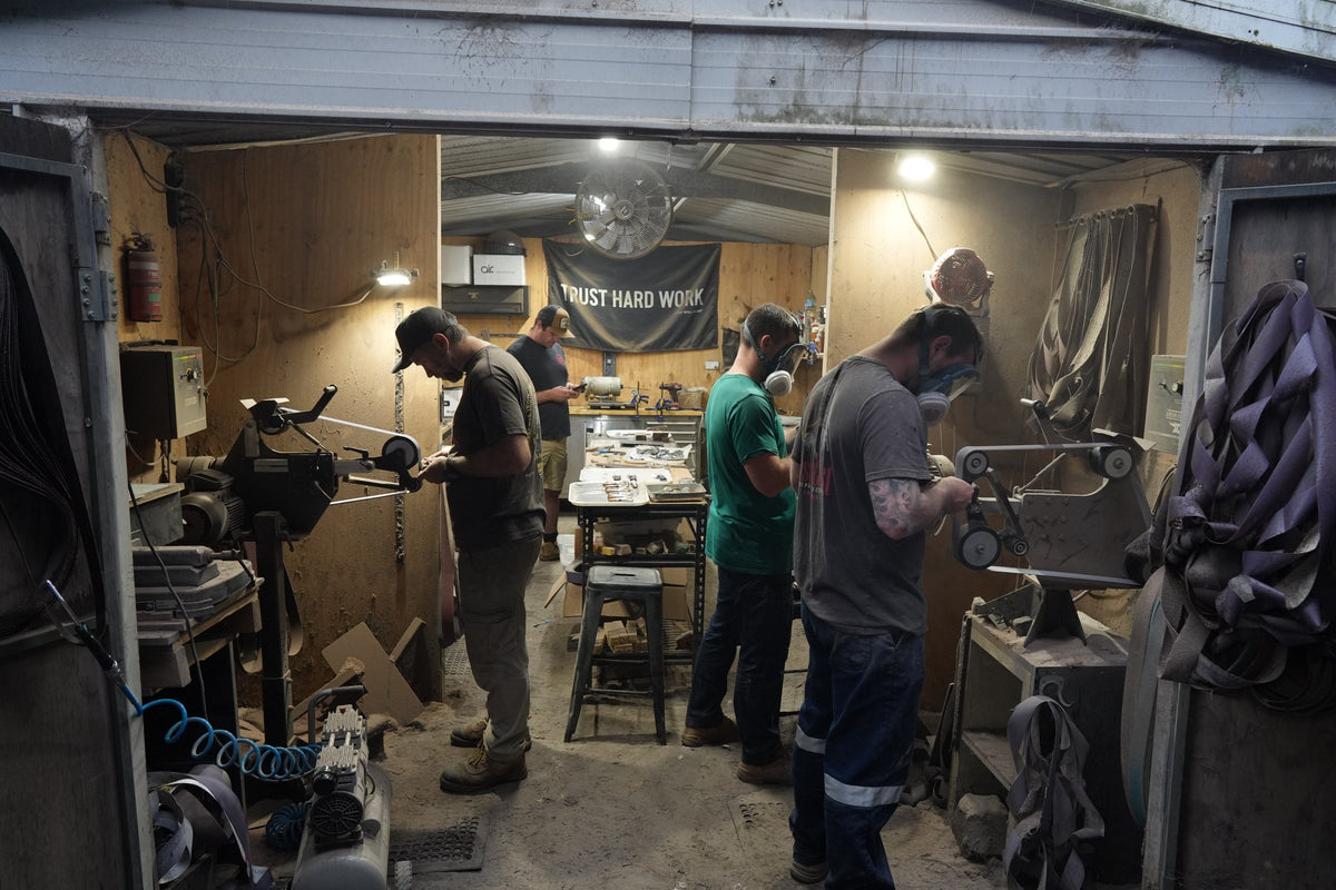 Iron Gate knifemakers working at their benches