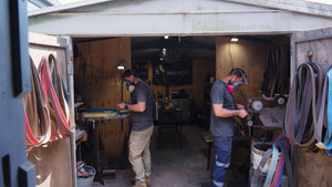 Iron Gate Knives maker grinding a blade by hand in the workshop