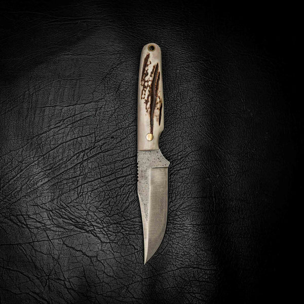 Fallow Antler Scout N690 — handle texture and brass pins close-up